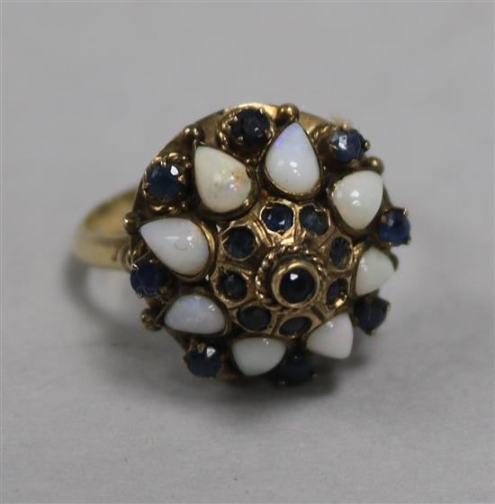 An 18ct gold, opal and sapphire cluster ring, size P.